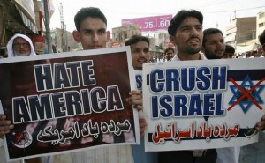 Pakistani Shi'ite Muslims hold placards during an al-Quds day rally in Multan